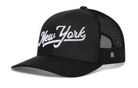 New York City White Script Trucker Hat  |  Black New York Snapback