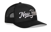 New York City White Script Trucker Hat  |  Black New York Snapback